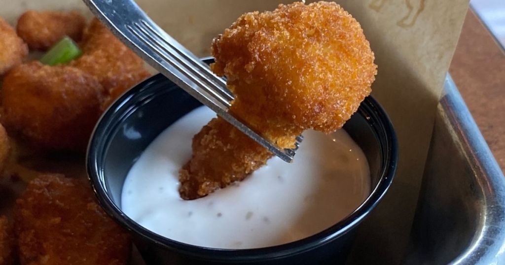 fork with breaded cauliflower wing dipped in ranch