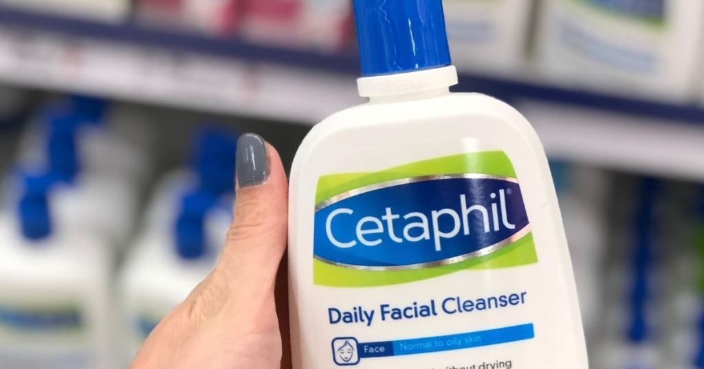 hand holding a bottle of Cetaphil Facial Cleanser