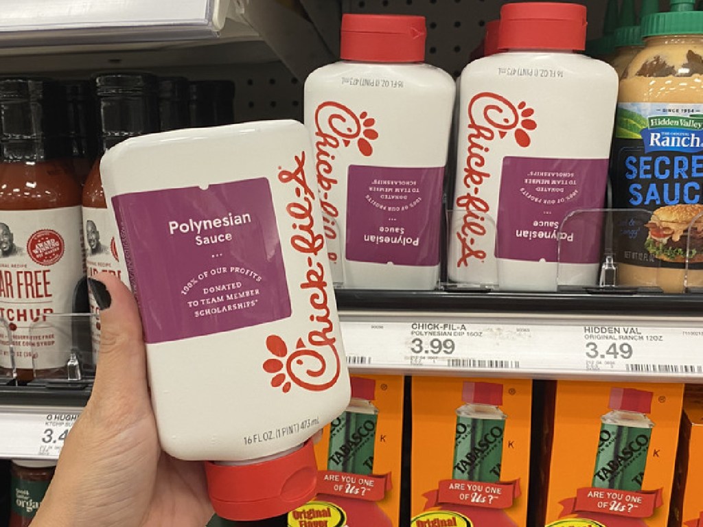hand holding bottle of Chick-fil-A Polynesian Sauce in store