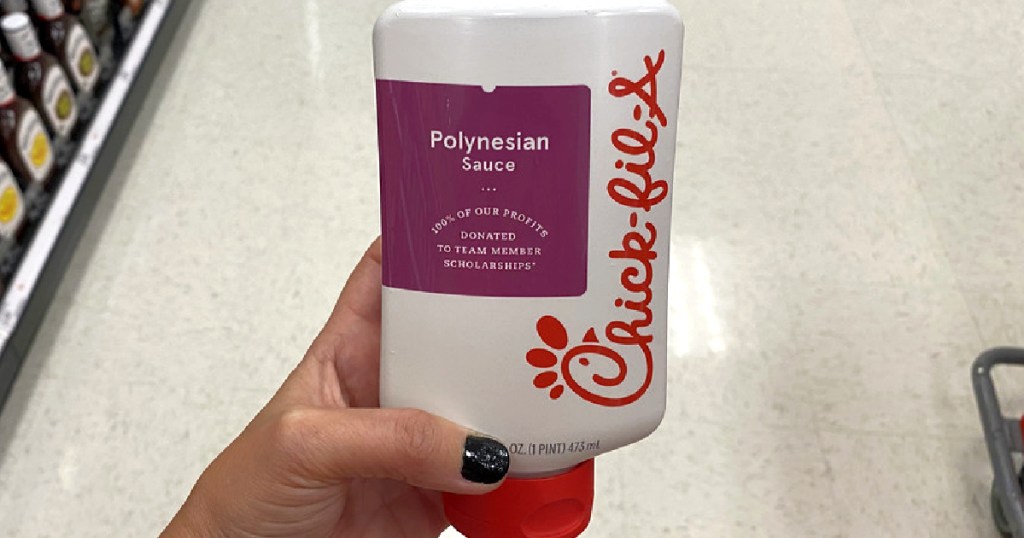 hand holding bottle of Chick-fil-A Polynesian Sauce in store