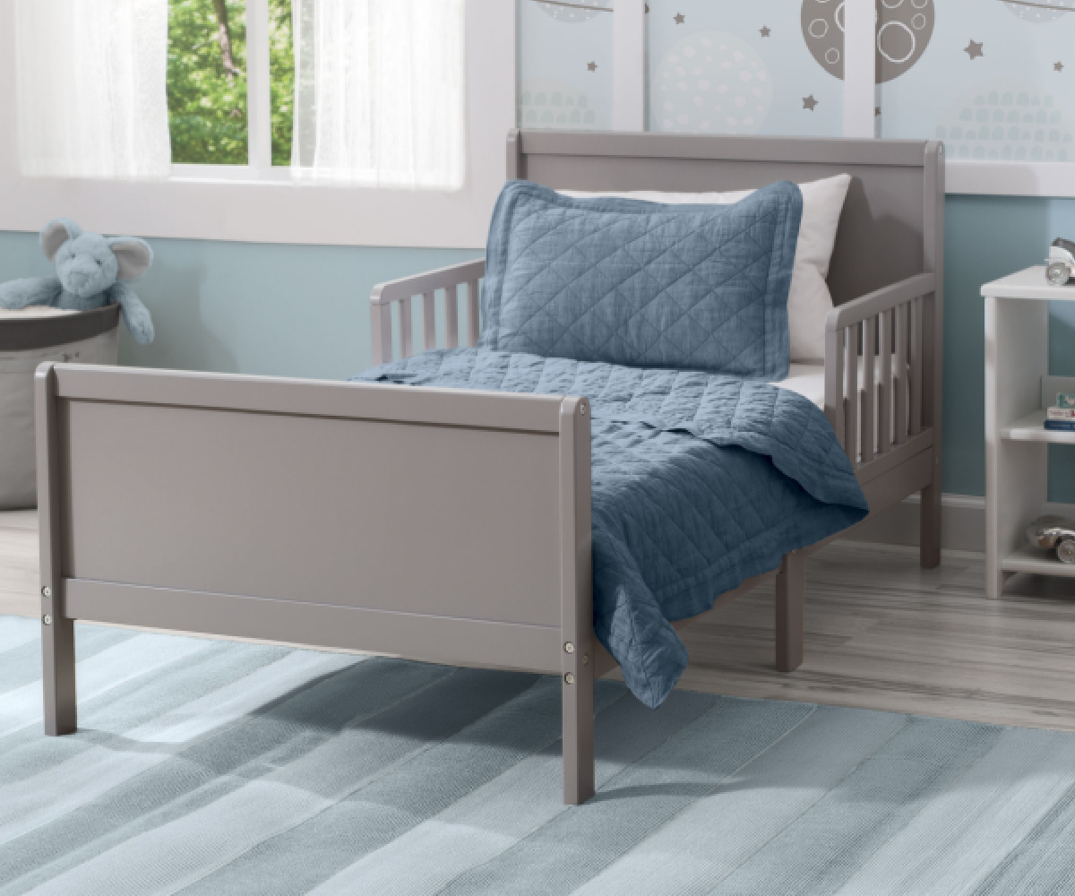 gray toddler bed in bedroom