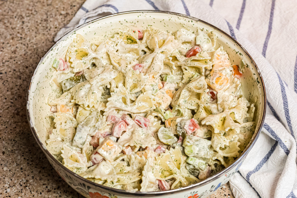dill pickle pasta salad in large serving bowl 