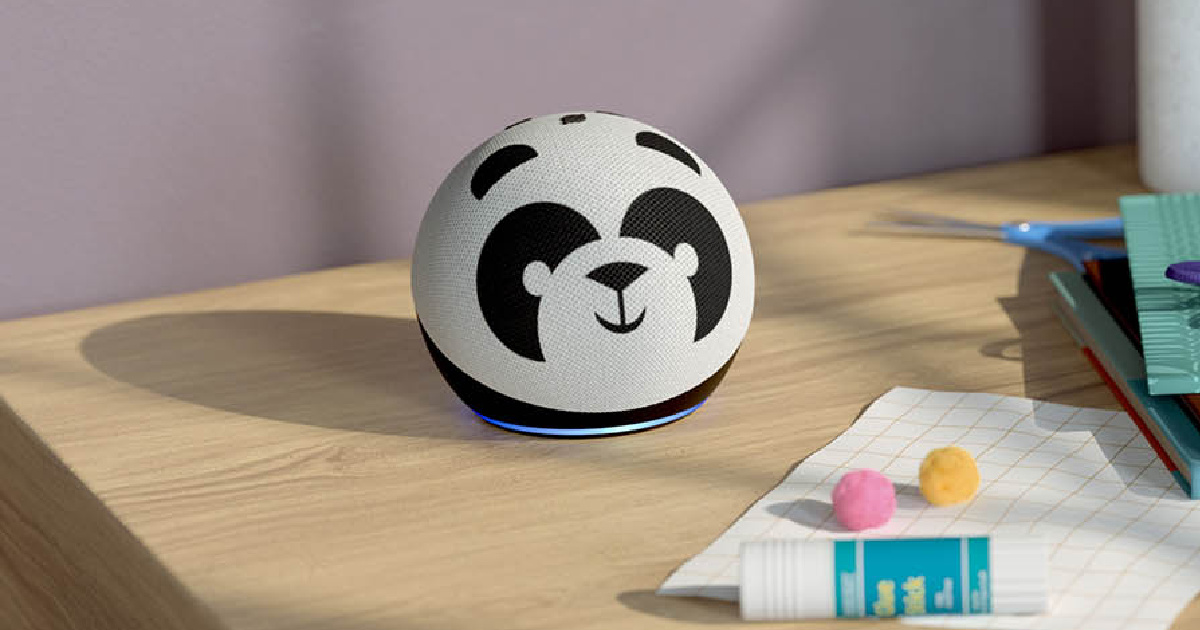 panda designed smart speaker on table with paper and glue stick