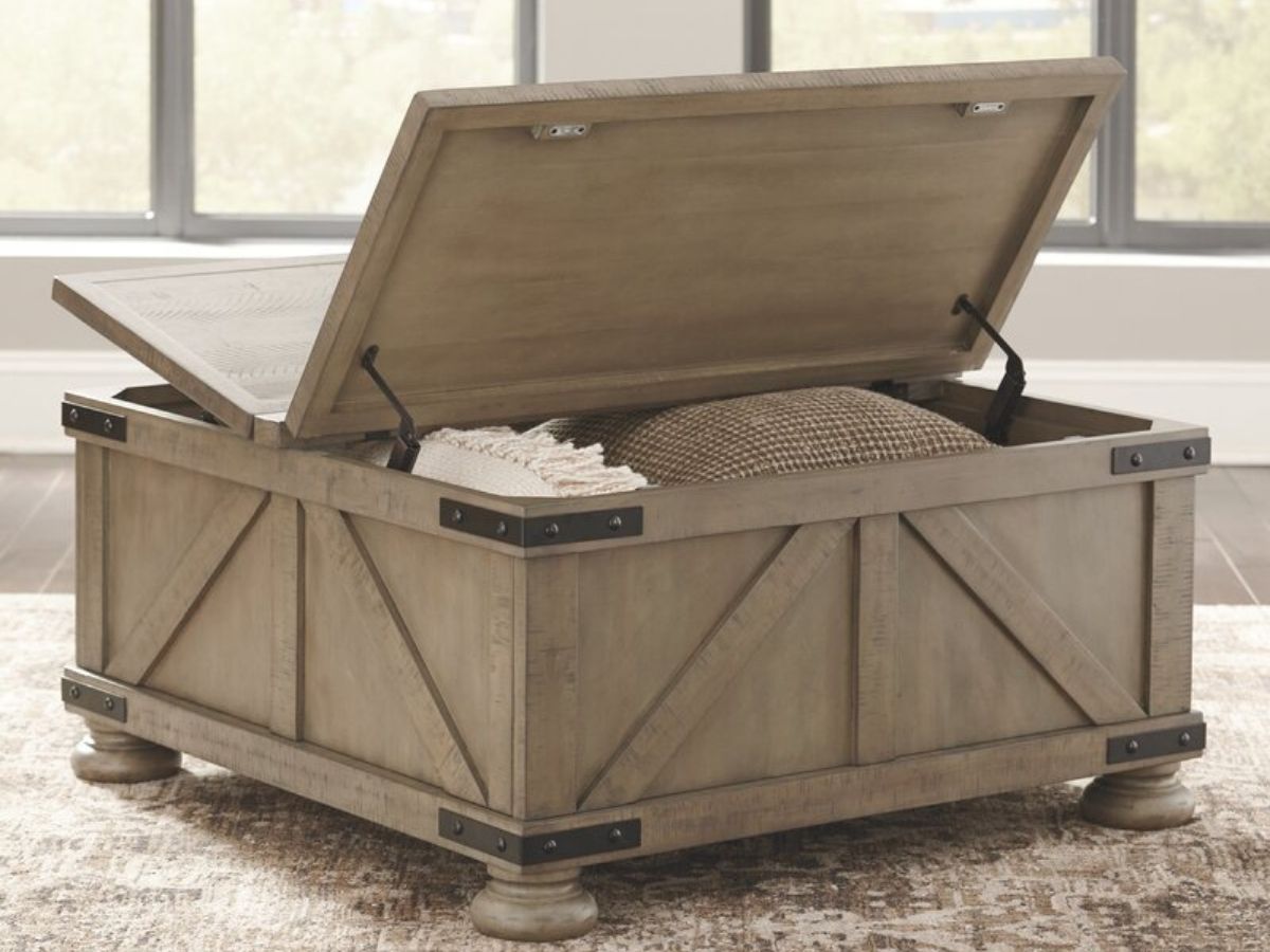 Farmhouse style coffee table with lifting top and blankets and pillows stored inside