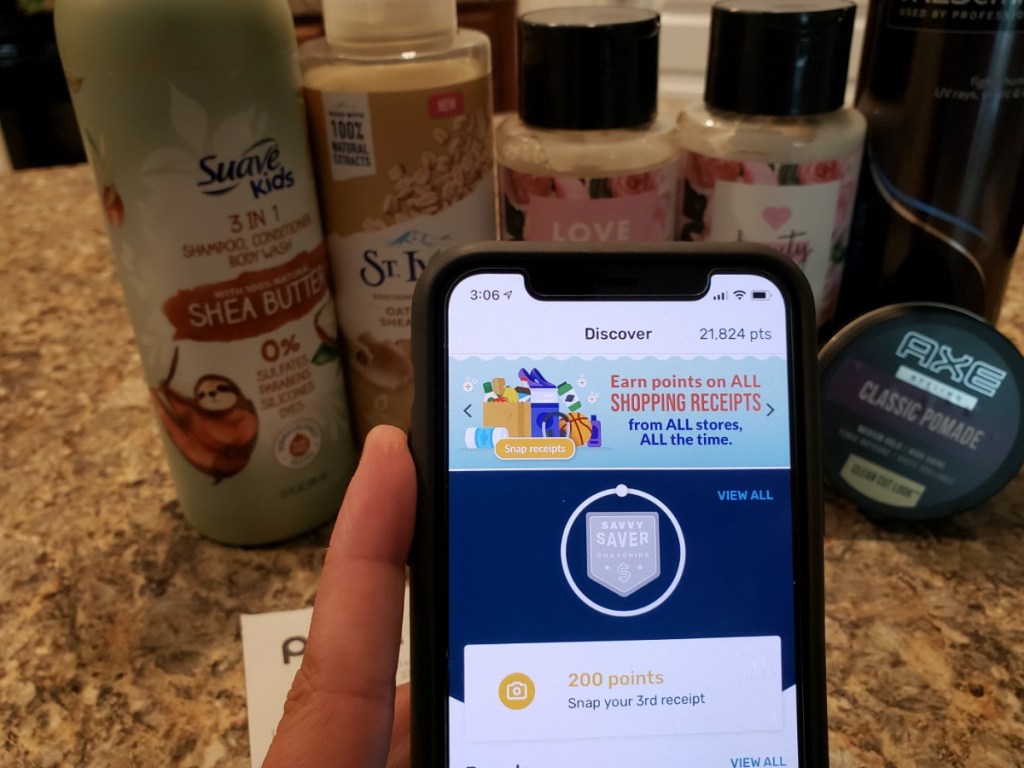 person holding iphone with Fetch Rewards app