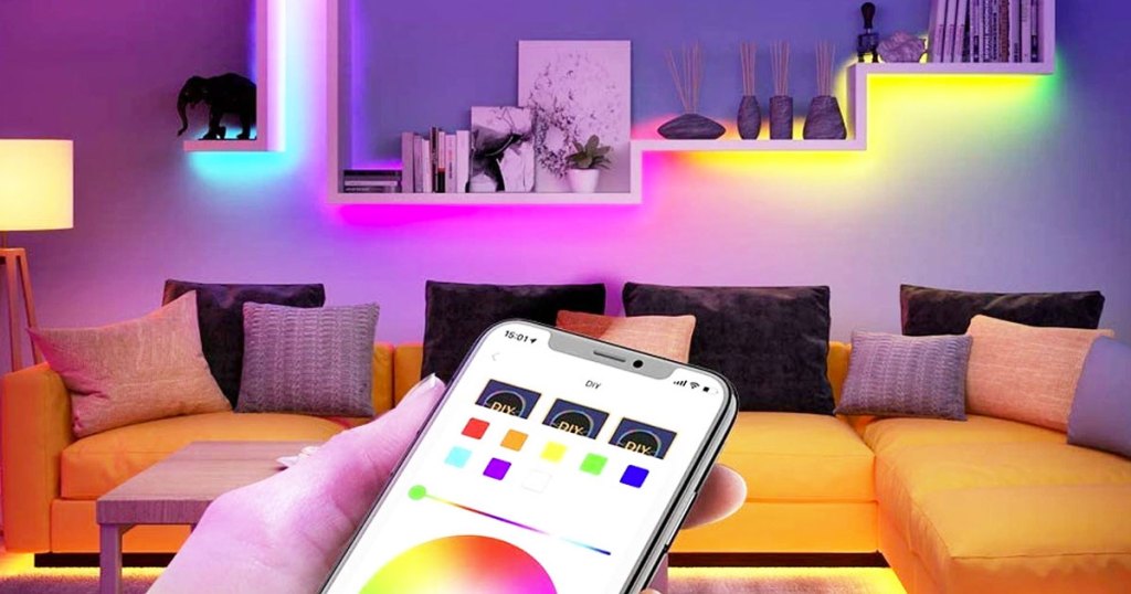 person using smartphone to control the colors of light strips installed under shelves on wall