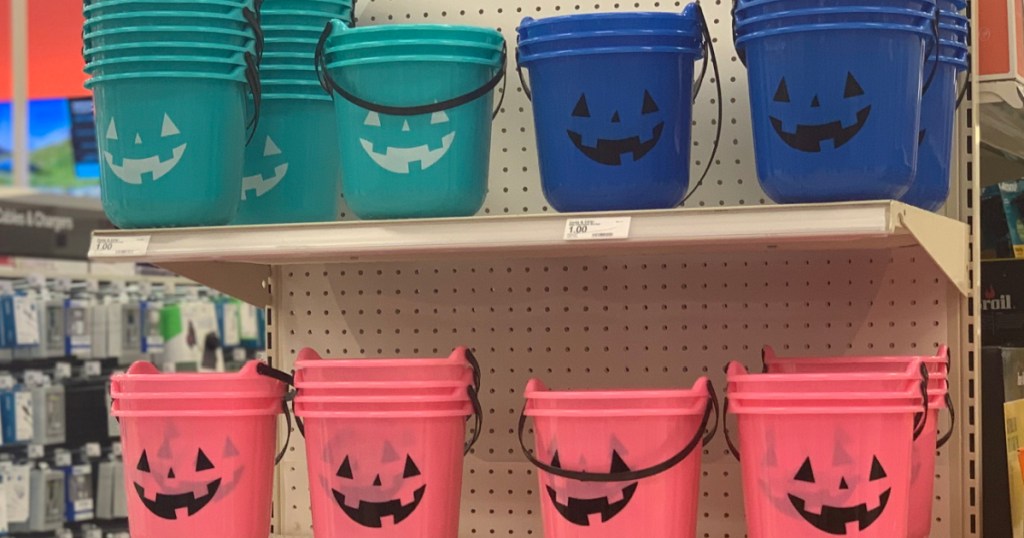 teal, blue, and pink Halloween buckets on store shelf