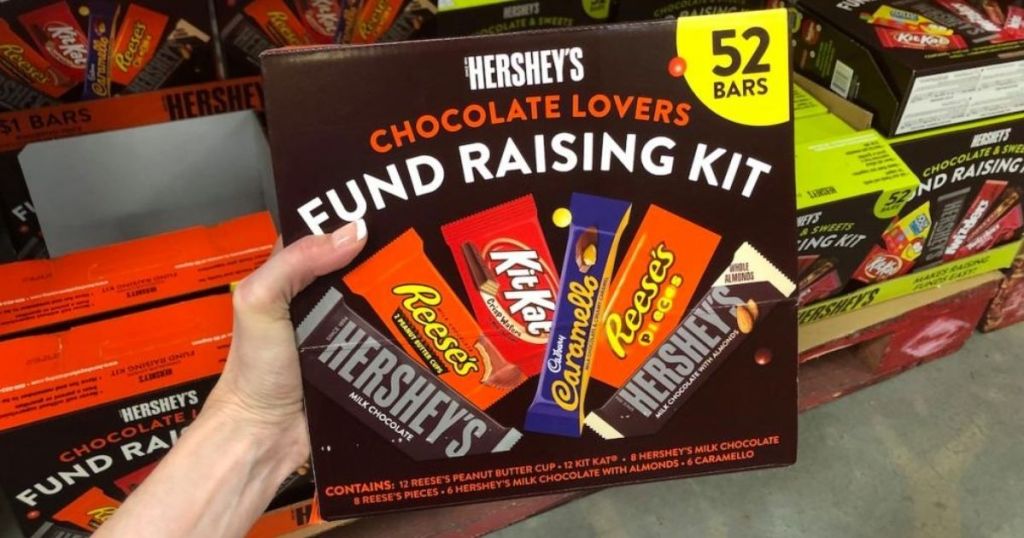 hand holding a box of Hershey's candy