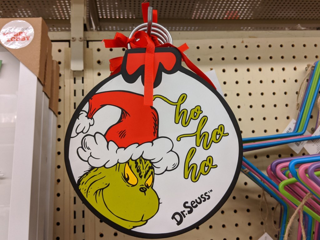 Grinch ornament wall decor hanging in store