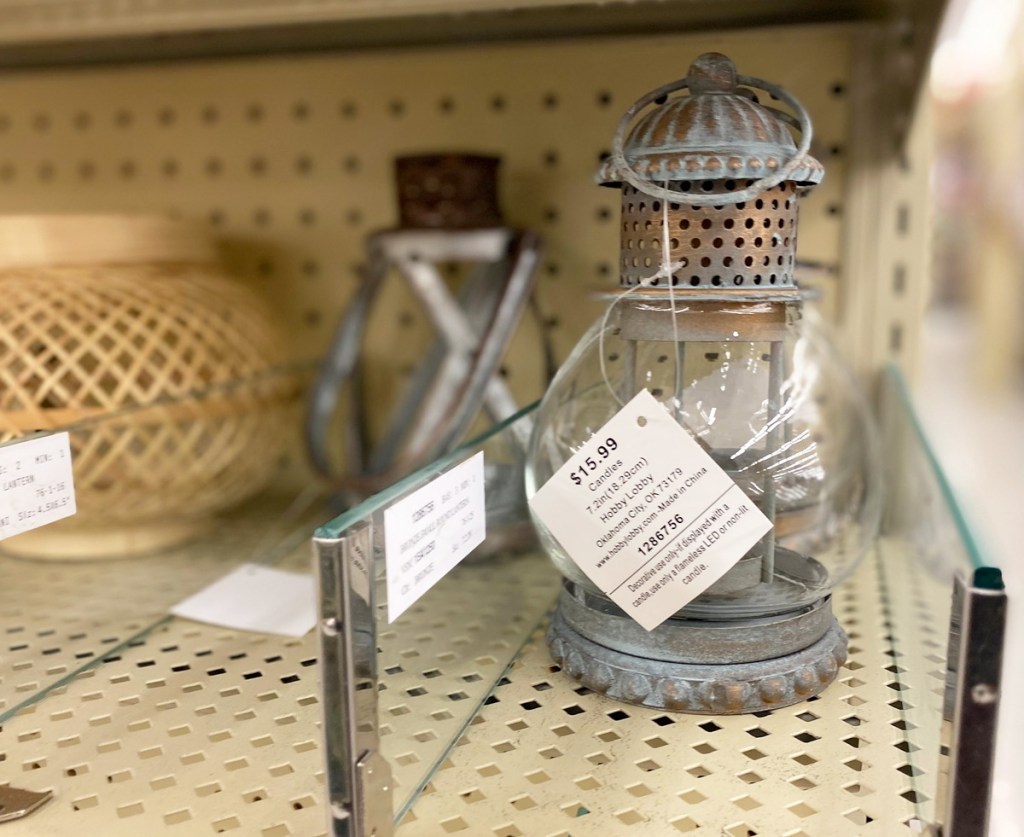 metal lantern shaped candle holders on shelf at Hobby Lobby