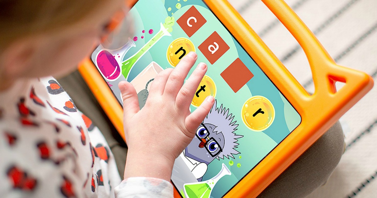 Young girl on a reading app on a kids orange tablet