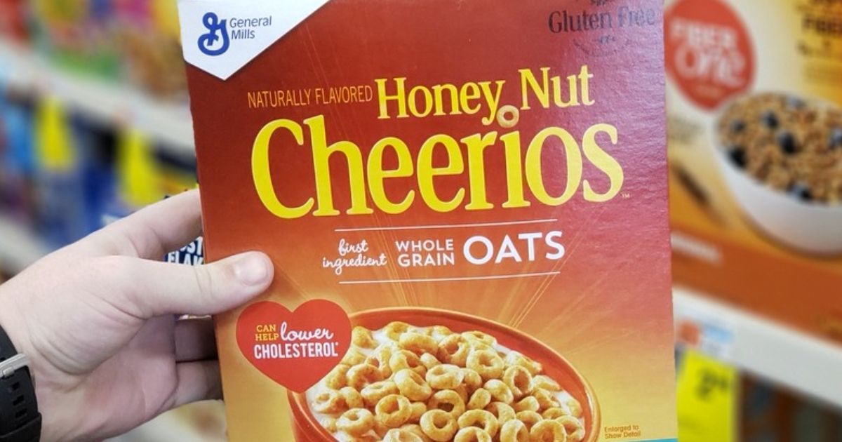hand holding box of Honey Nut Cheerios