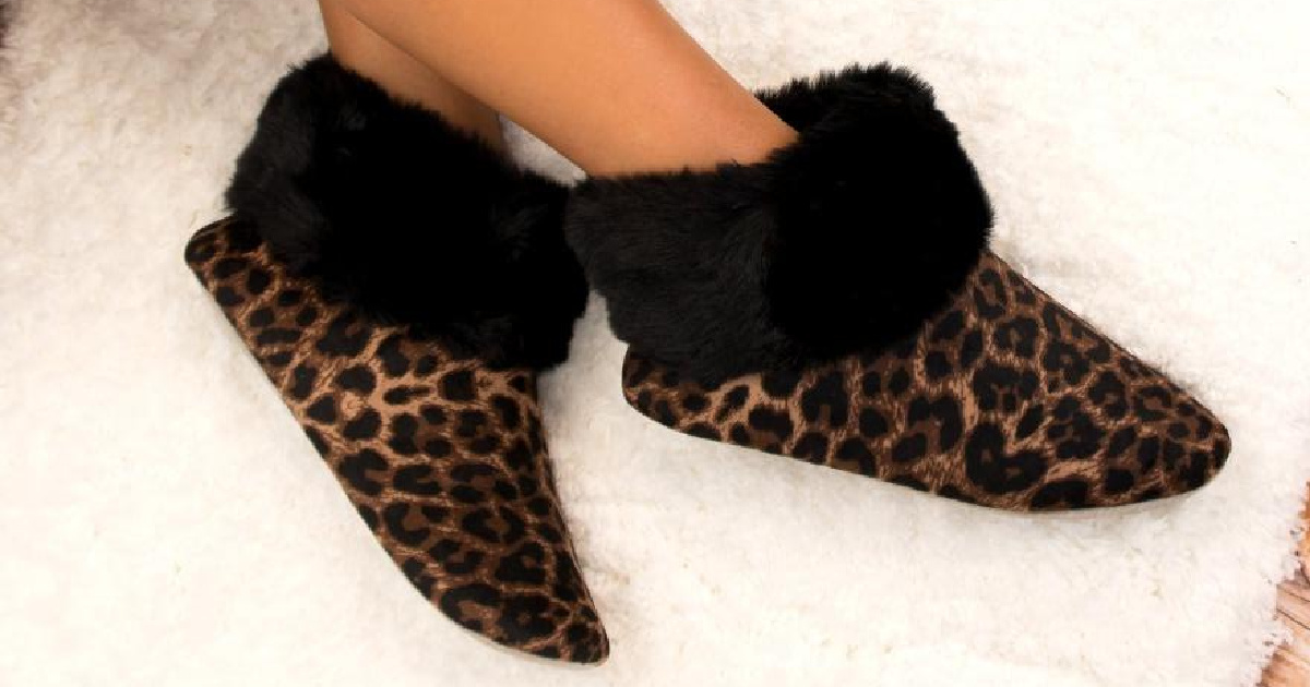 legs wearing leopard slippers