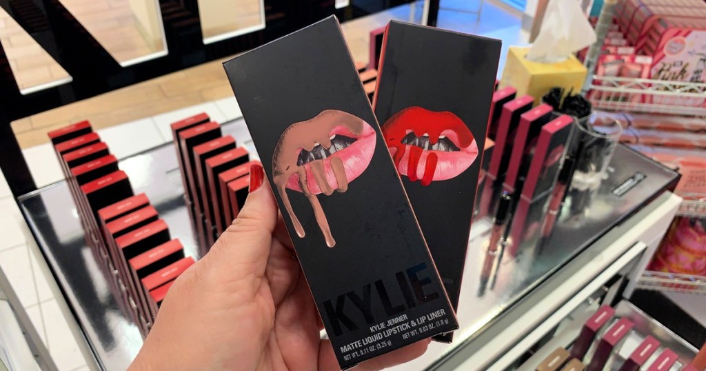 Kylie Cosmetics Lip Kits in woman's hand