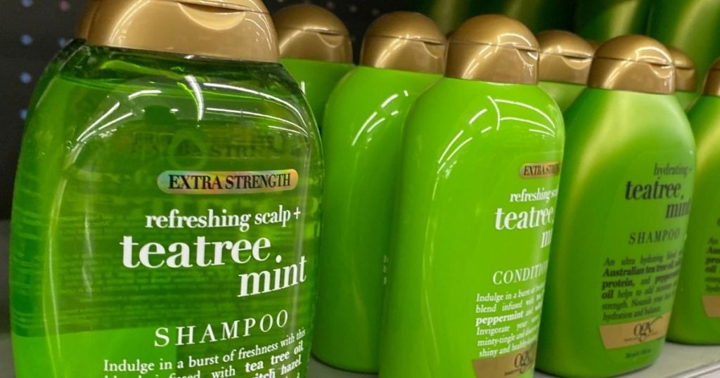 row of OGX shampoo and conditioners on shelf