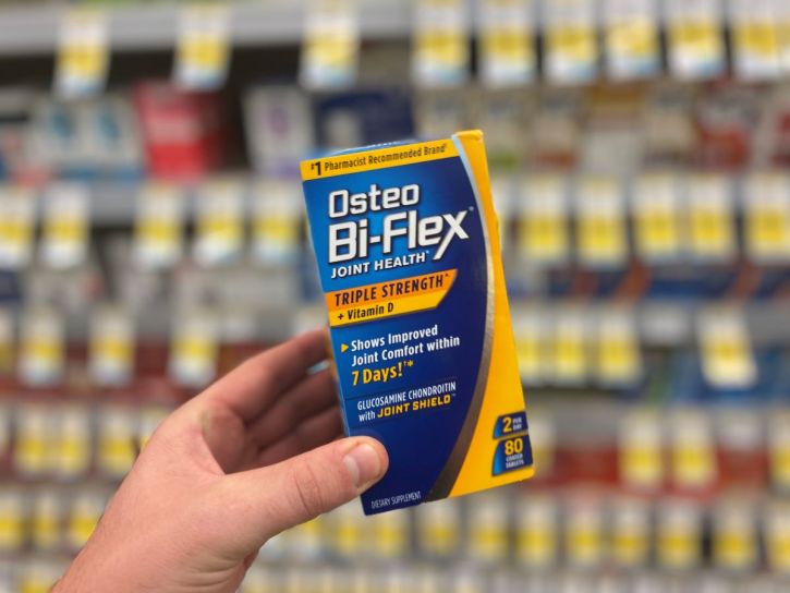 hand holding box of Osteo Bi-Flex vitamins