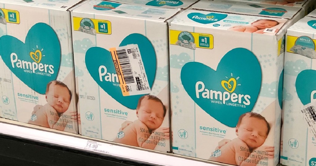 3 large boxes of pampers wipes sitting on a store shelf