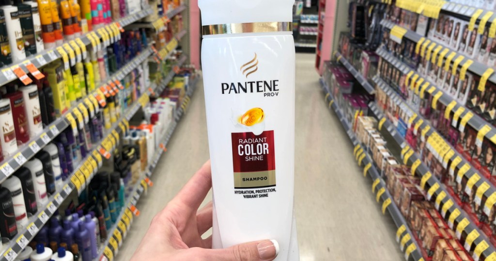 hand holding pantene radiant color shampoo on store