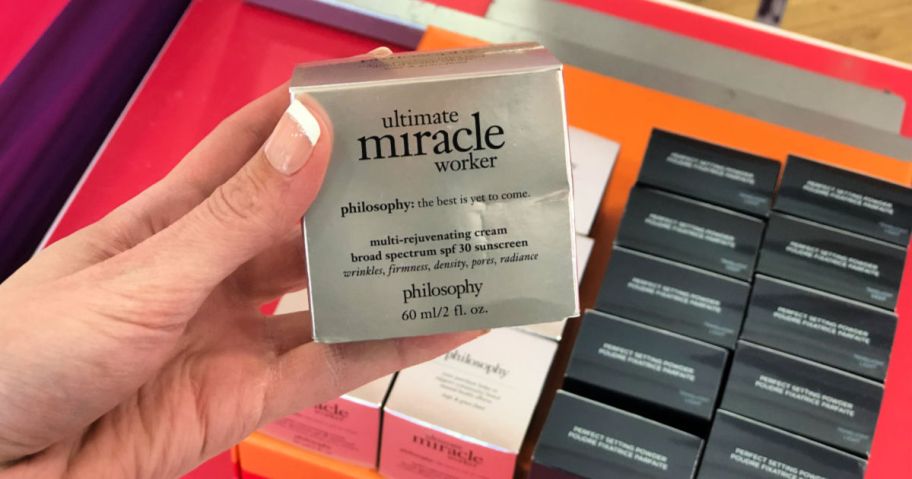 Woman hands holding ultimate miracle worker box