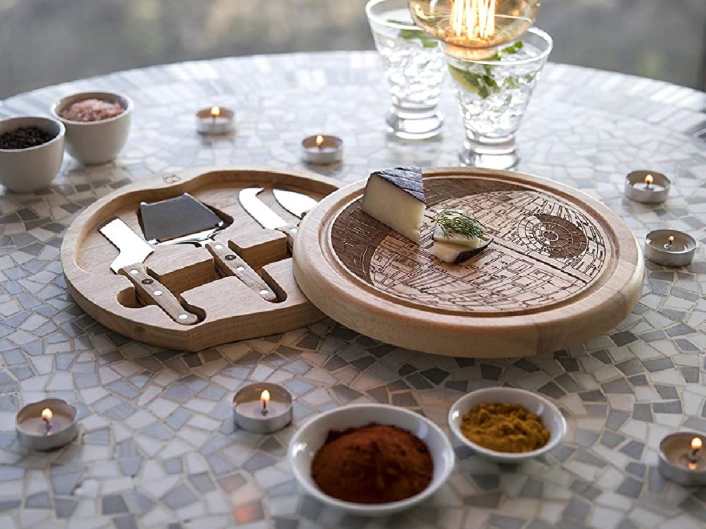 Star Wars Death Star shaped cheese board, tools, and food on table