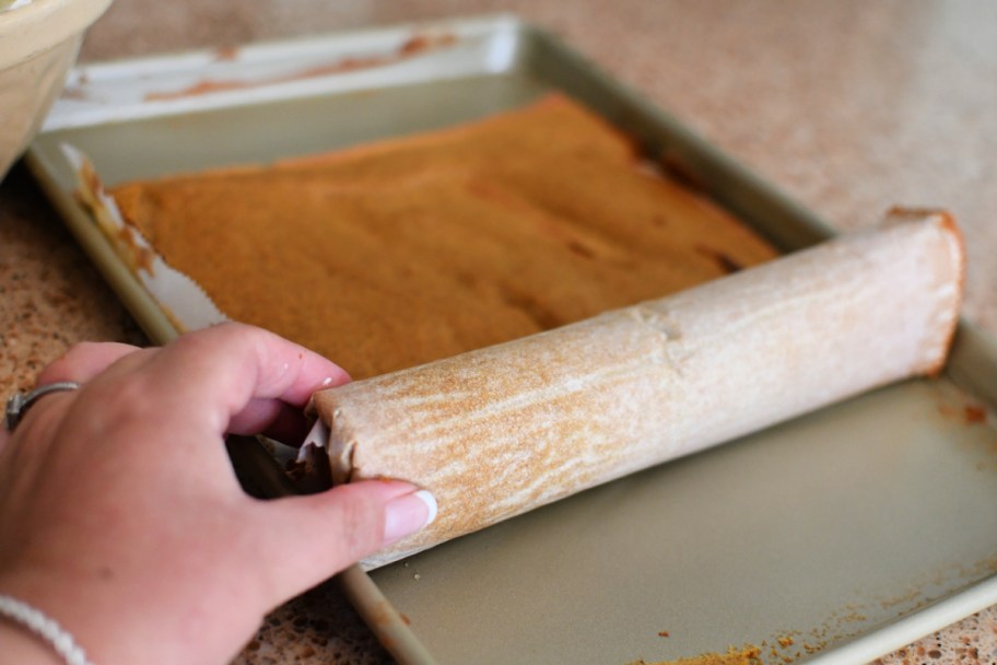 Rolling a pumpkin cake