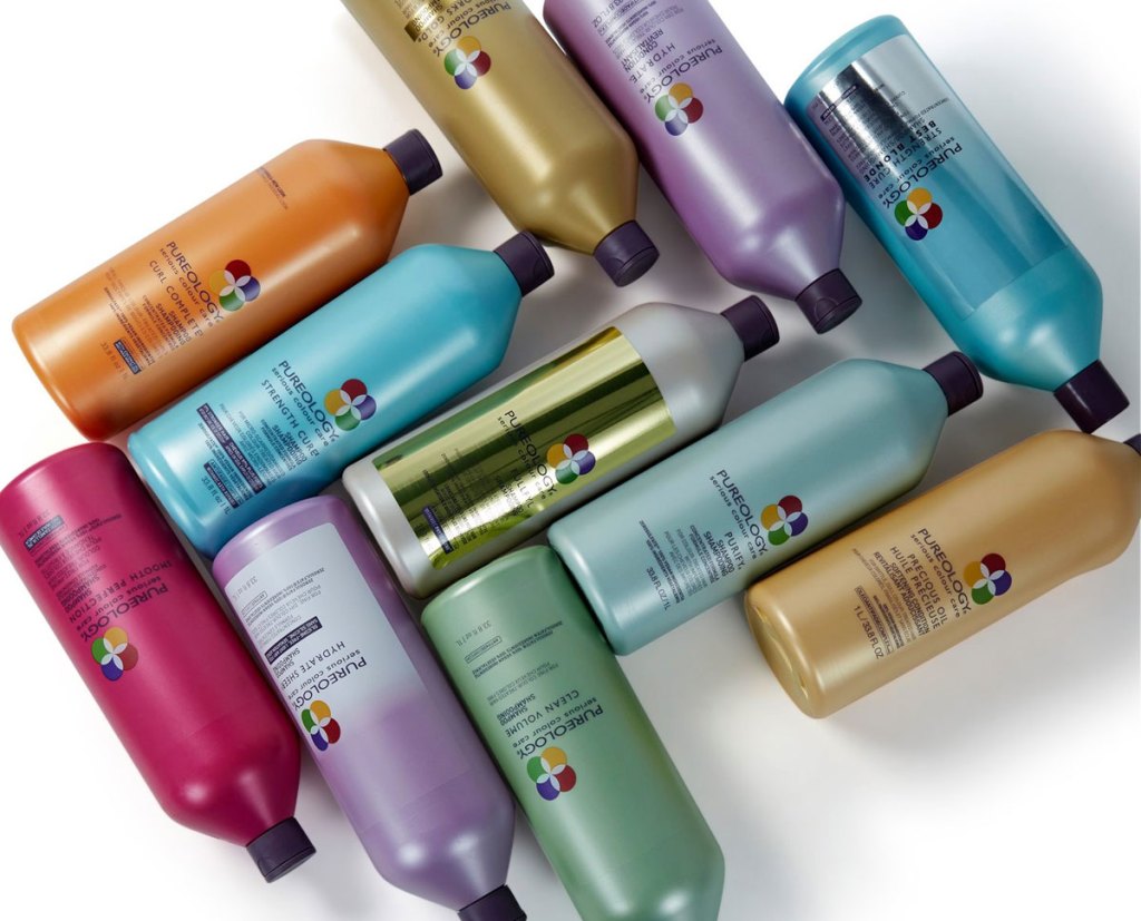 liter size bottles of pureology shampoo and conditioner in various colors