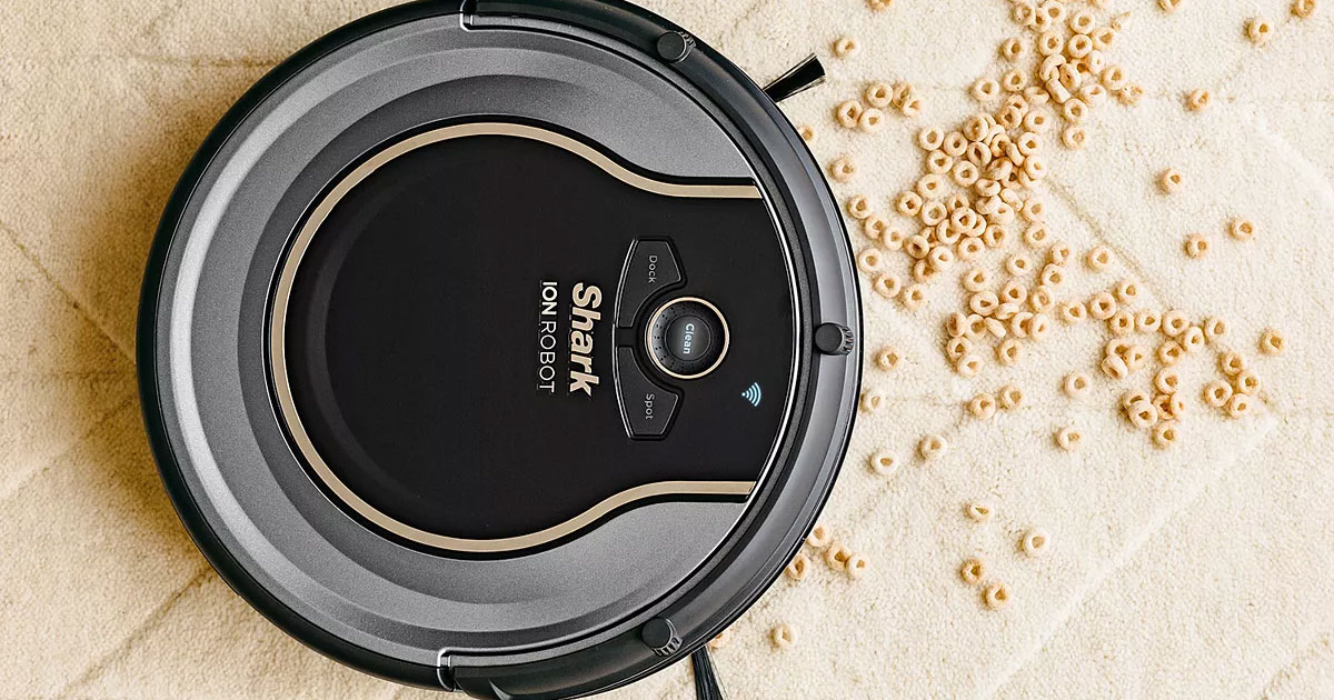 shark robotic vacuum cleaning up spilled cereal on carpet