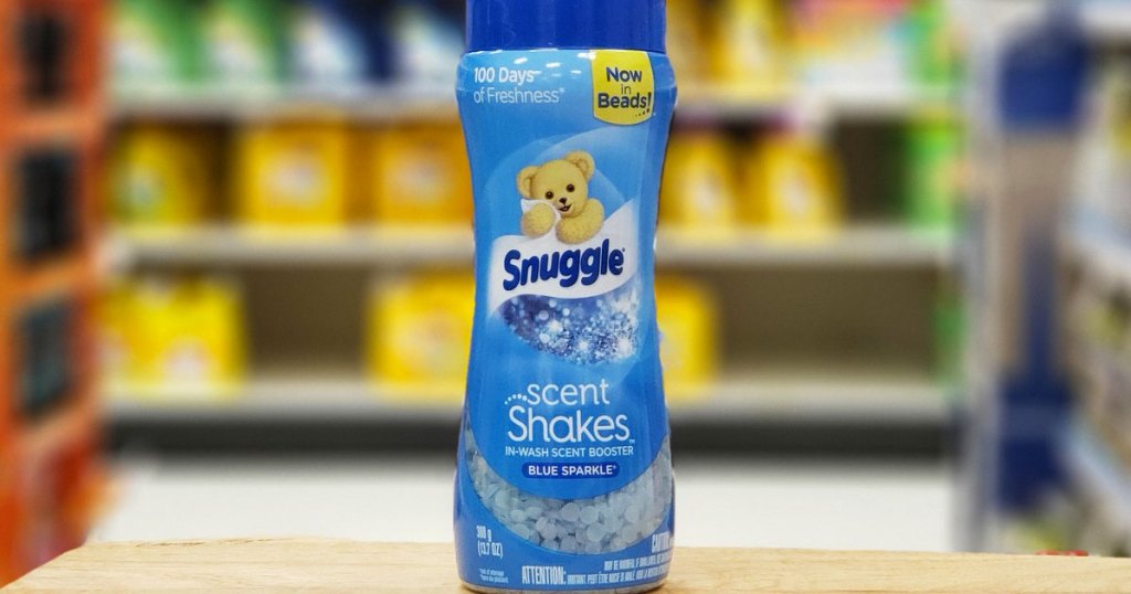 blue bottle of snuggle scent booster beads on a wood table at Target