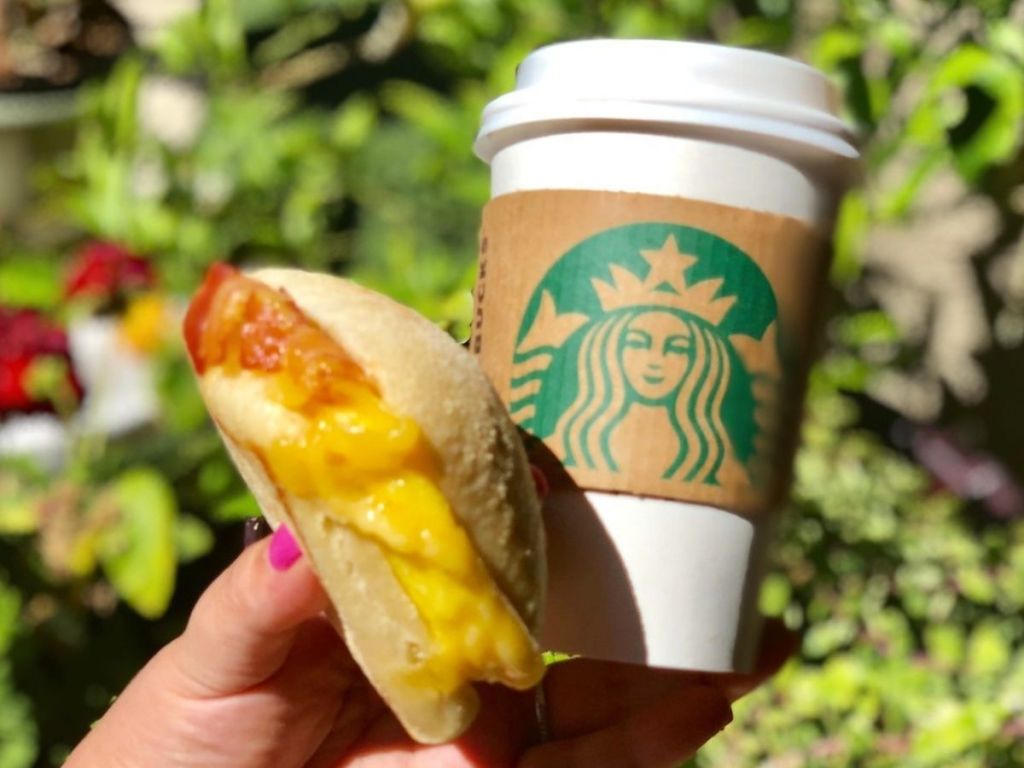 Starbucks Breakfast Sandwich and Hot Drink in Woman's Hand