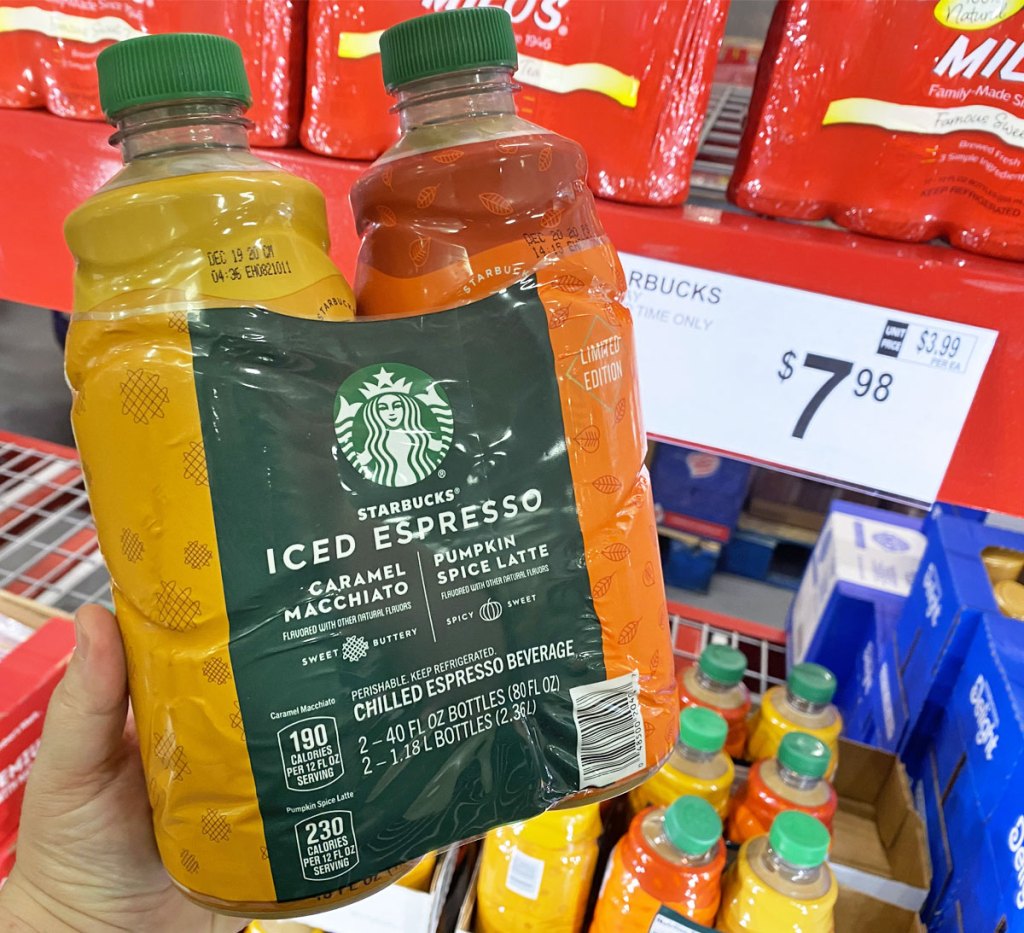 person holding up two pack of starbucks chilled espresso drinks