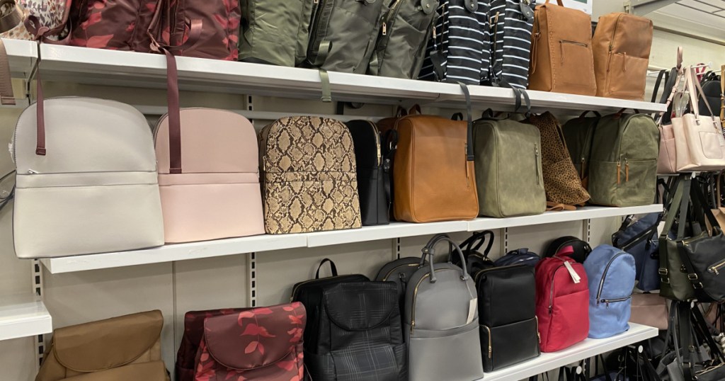various handbags and backpacks on store shelves