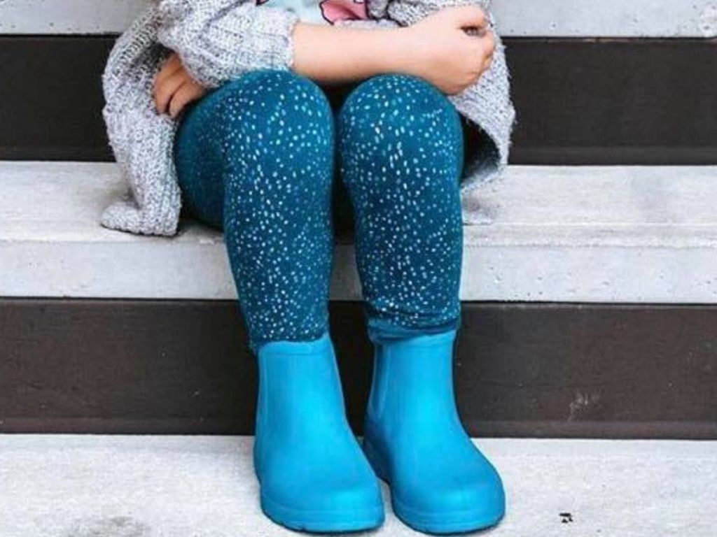 little girl wearing low rain boots