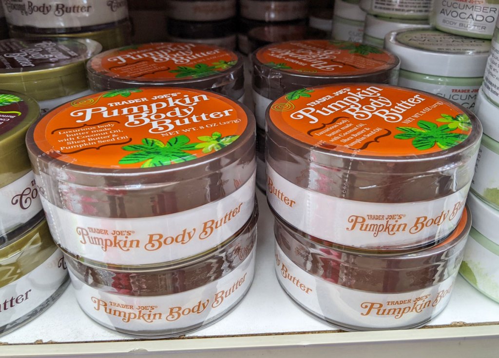 round containers of pumpkin body butter on white store shelf