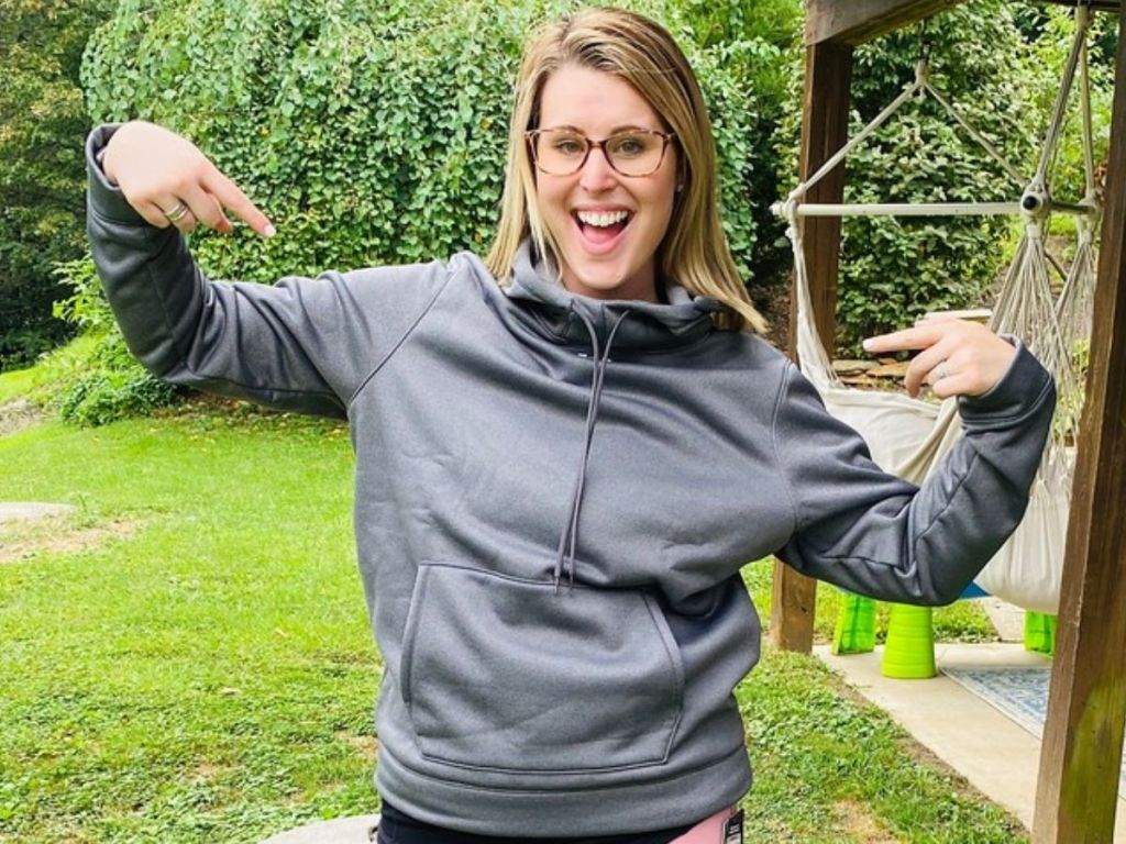 woman wearing funnel neck Under Armour Hoodie