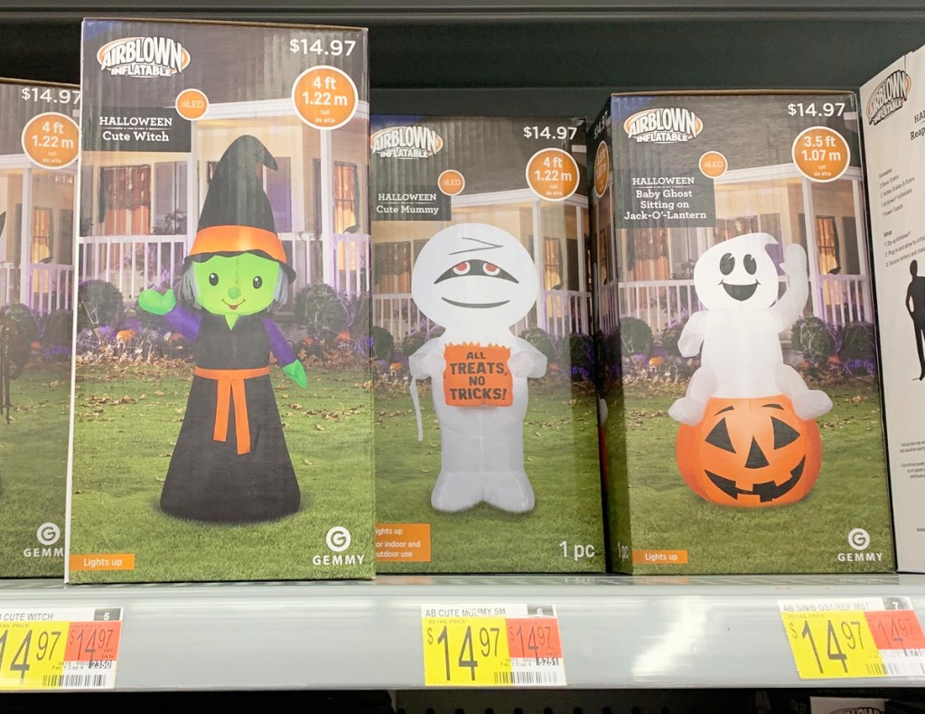 boxes of various 4ft tall Halloween inflatables on Walmart shelf