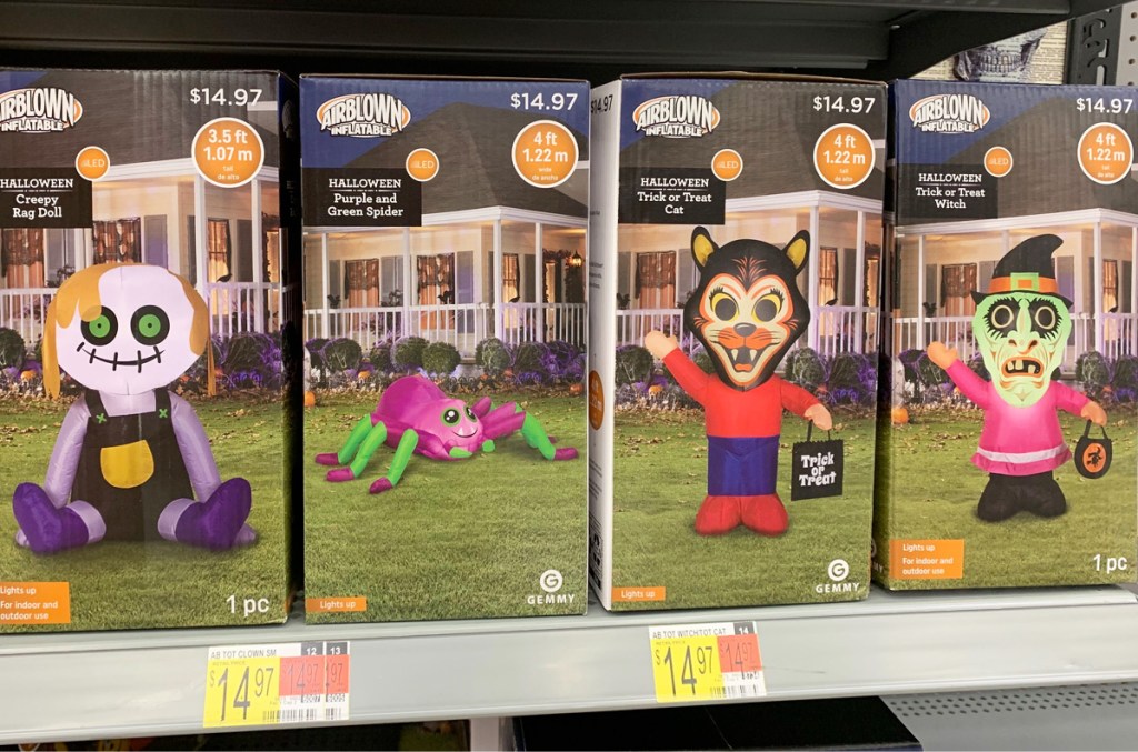 boxes of various 4ft tall Halloween inflatables on Walmart shelf