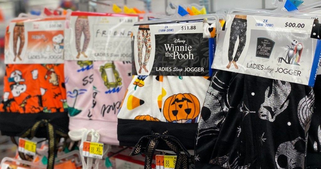 multiple pairs of women's halloween pajamas on a rack at walmart 