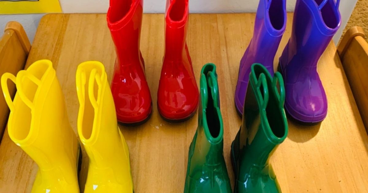 four pairs of Zoogs kids rain boots