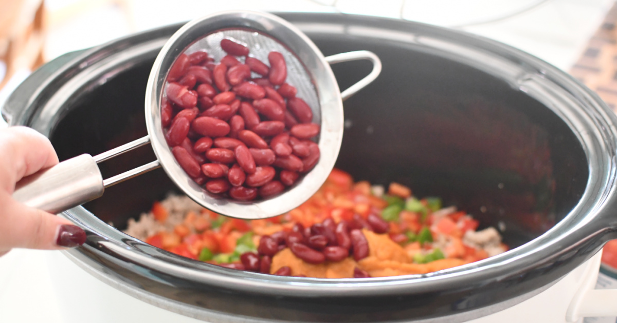 adding beans to crockpot