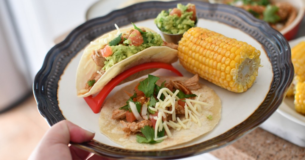 eat at home carnitas tacos on a plate with corn