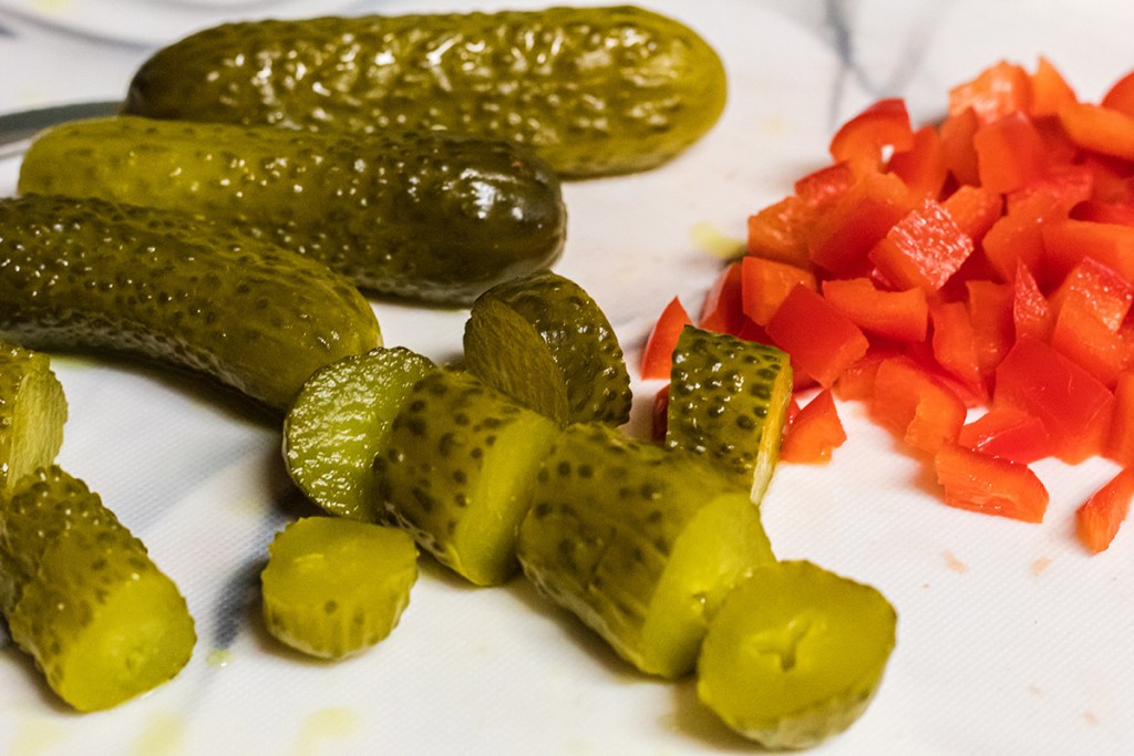 chopped pickles on cutting board