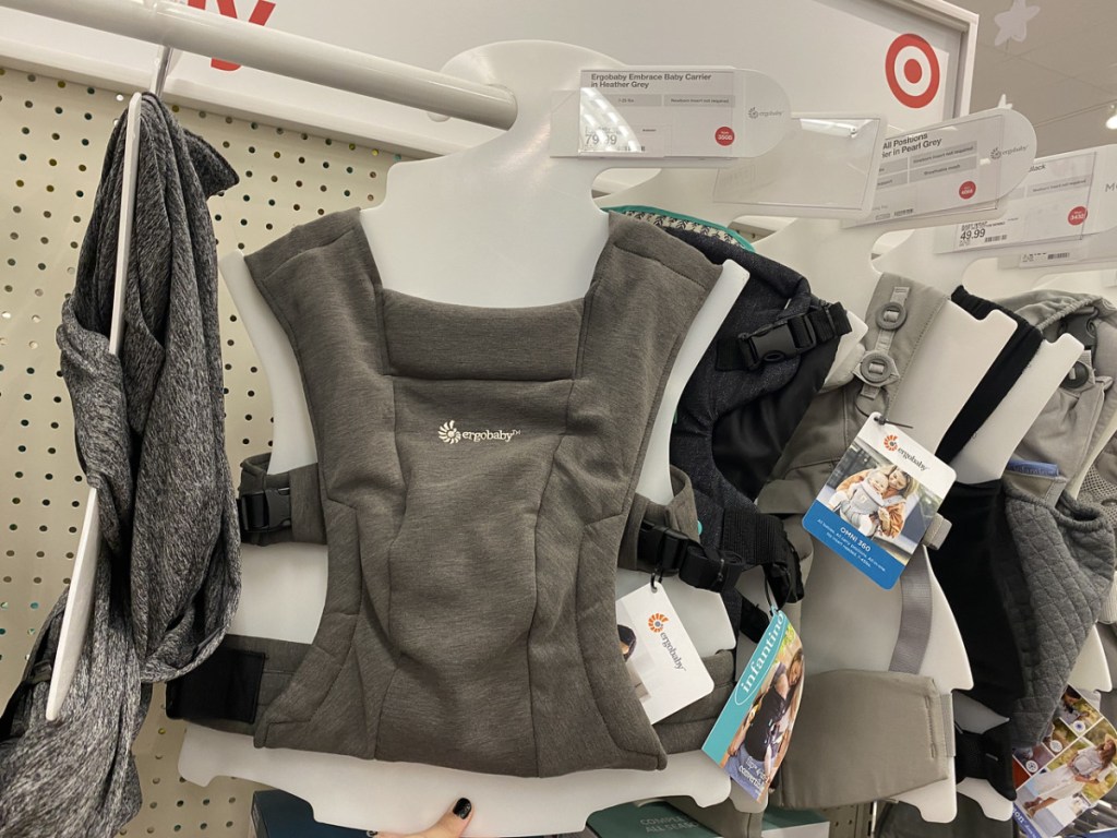 baby carriers in store hanging up