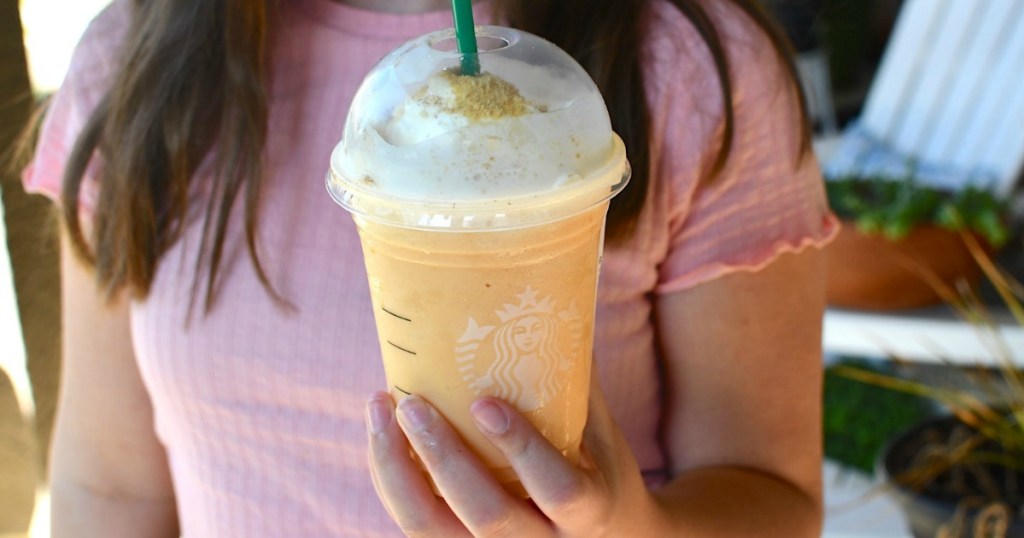 girl holding Starbucks secret menu pumpkin frappuccino 