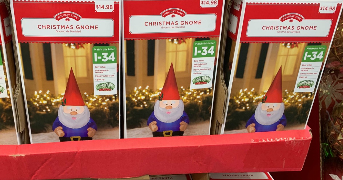 inflatable christmas gnomes in boxes on a store display