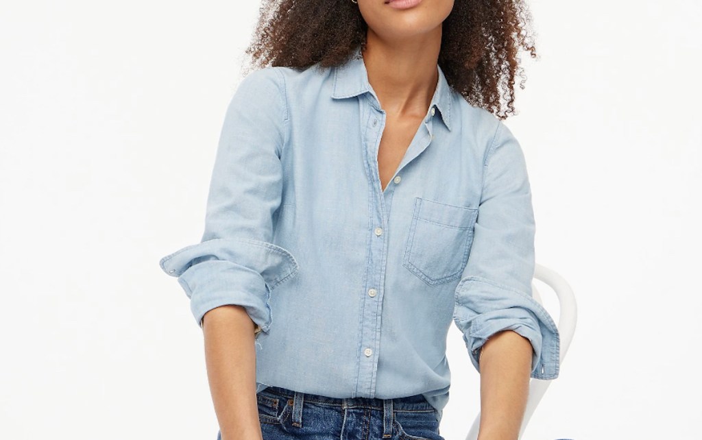 woman posing in chambray shirt with white background