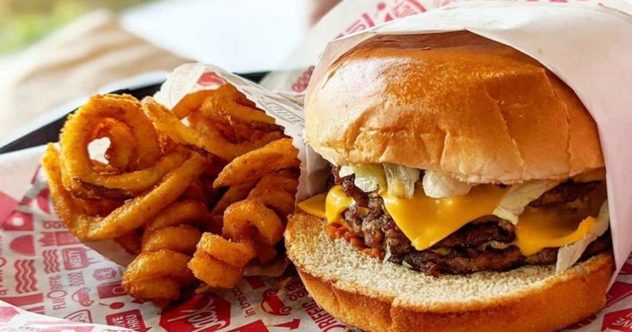 burger next to curly fries