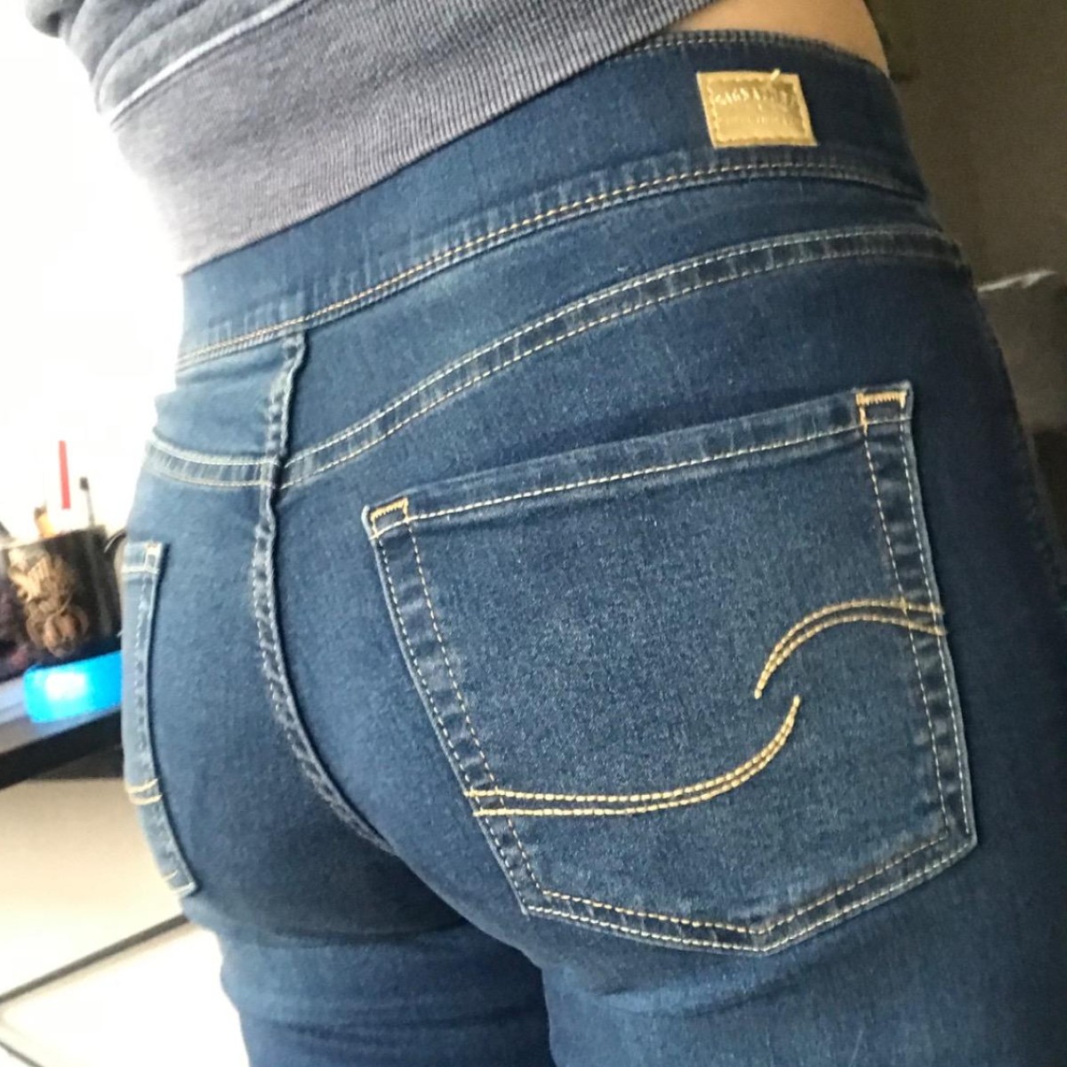 back side of woman wearing jeans
