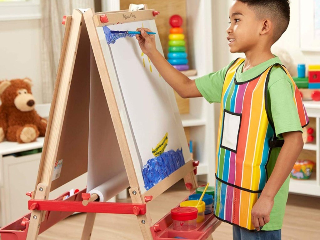 boy painting on easel