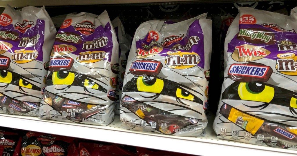 bags of halloween candy on a store shelf