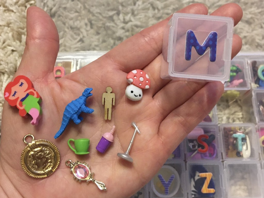 hand showing small minature items